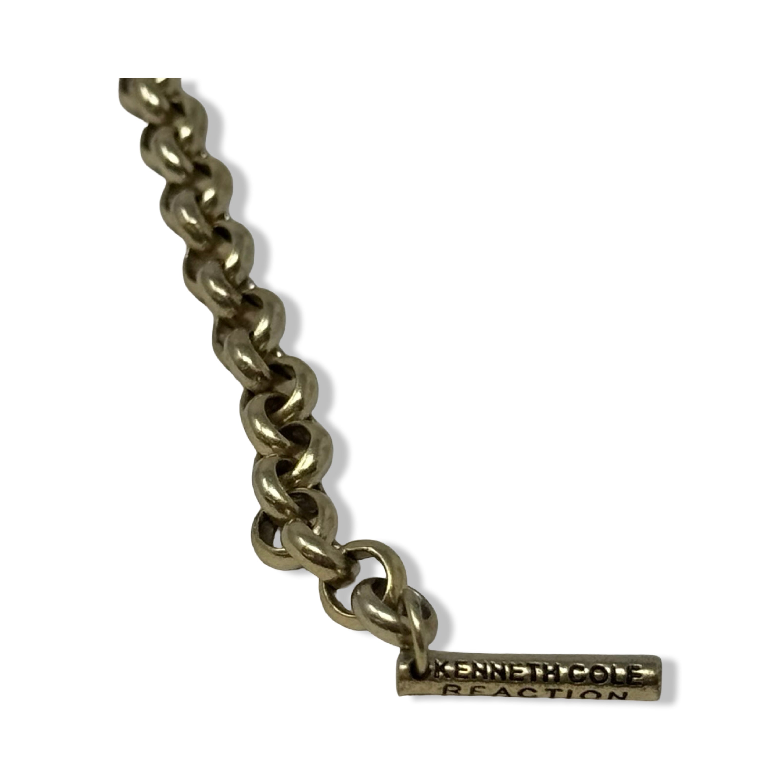 Gold chain with a logo tag on a white background