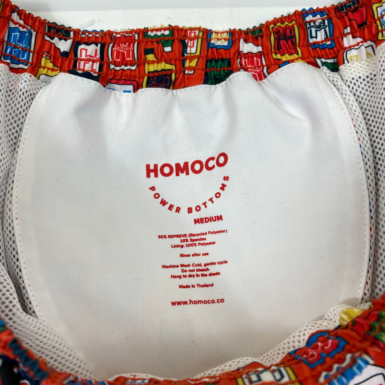 Homoco Red Logo and Bottle Print Swim Trunks-Label